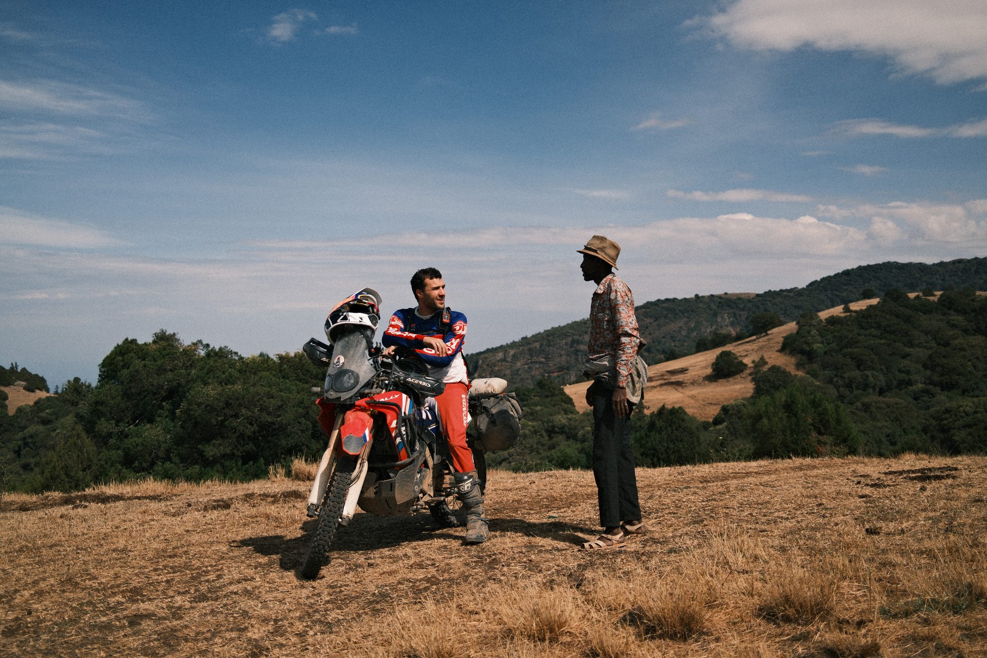 A rider and a bike on a hillside