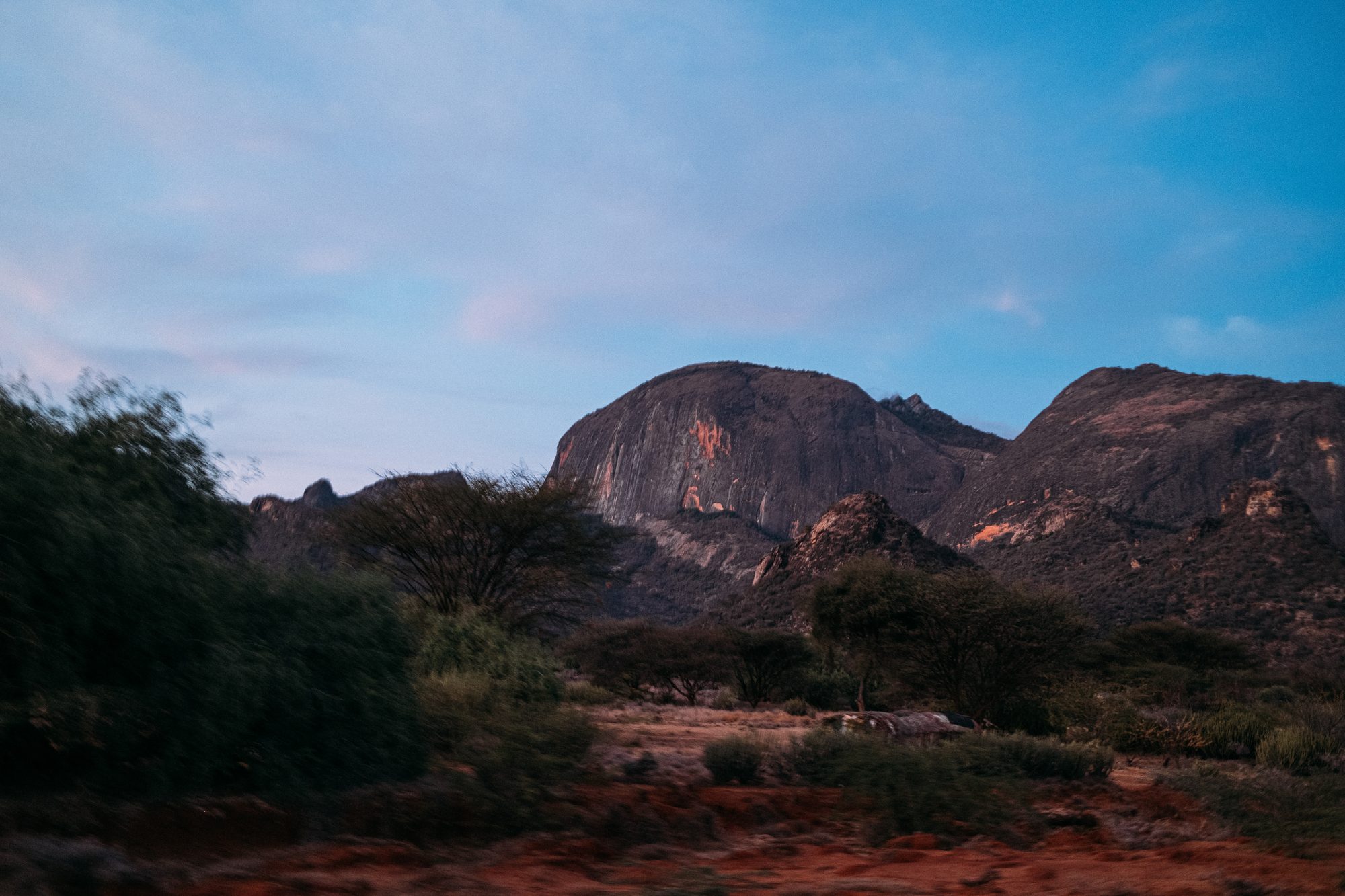 Mountains at dusk over a dirt road in northern Kenya