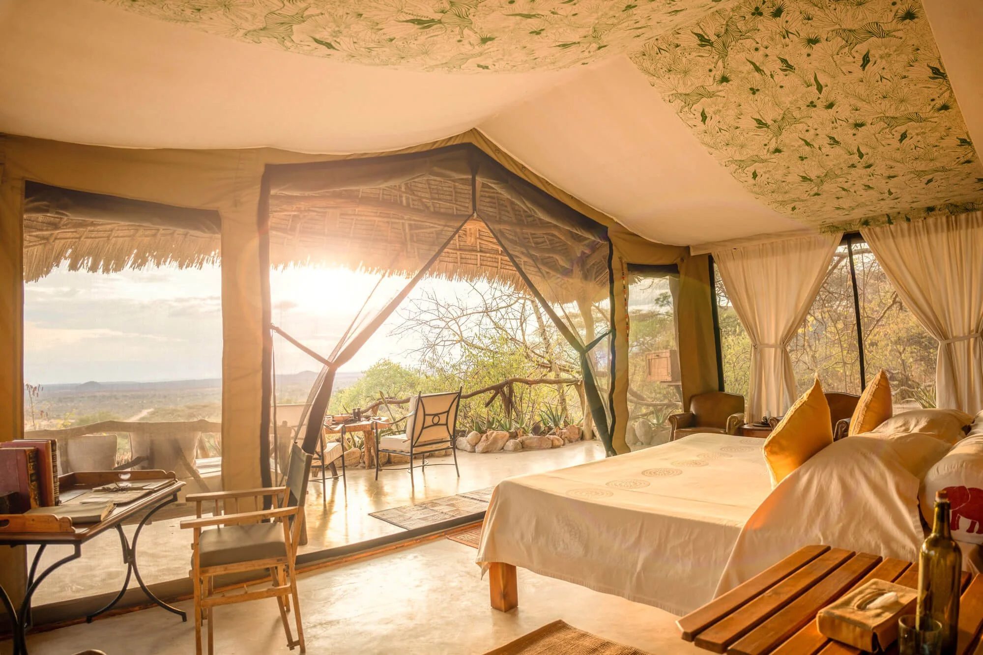 A tented bedroom at Sarara Camp, open to the morning light